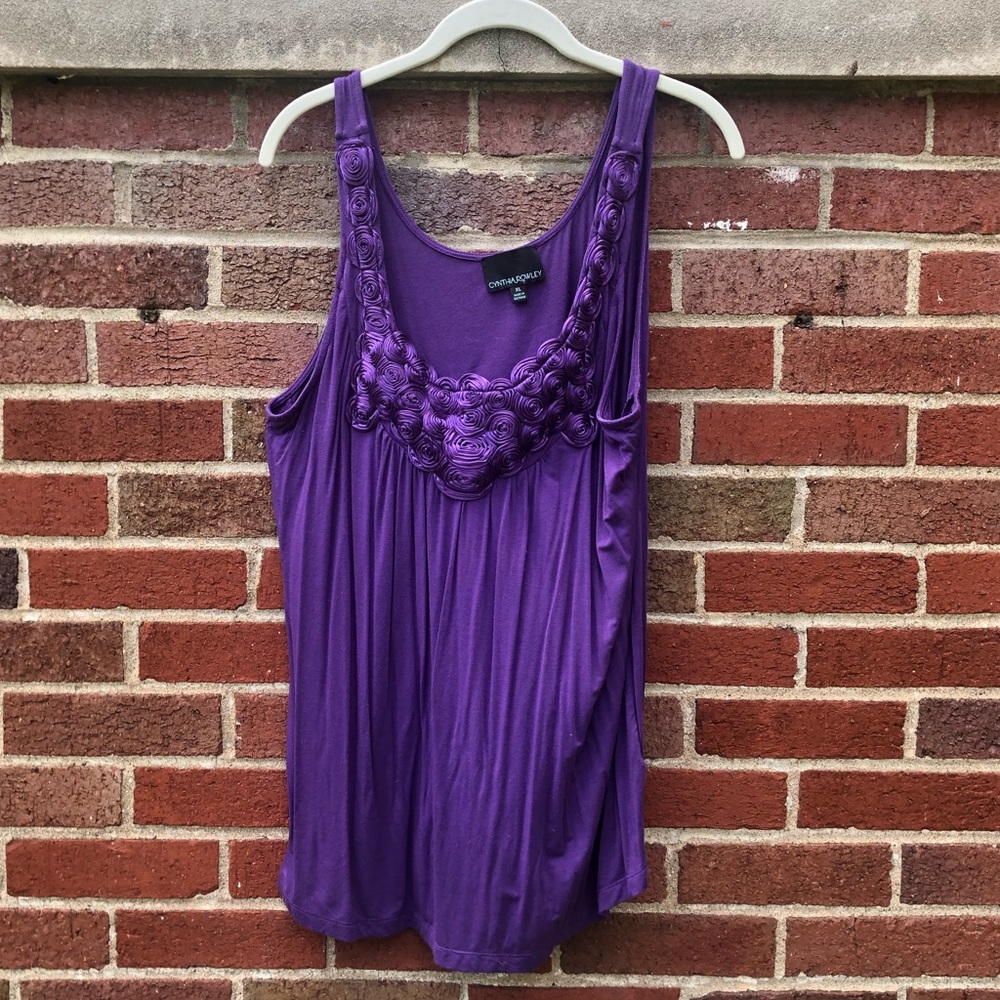 Purple flowy sleeveless top with rosettes